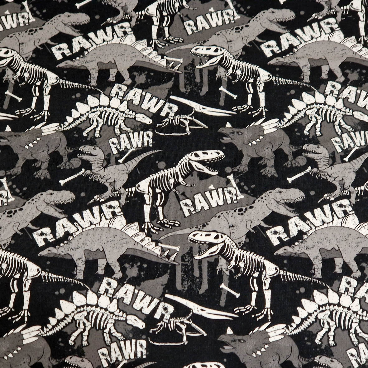 Stoff von Dinosaurier-Muster in Schwarz und Grau mit dem Schriftzug "RAWR" in verschiedenen Positionen.